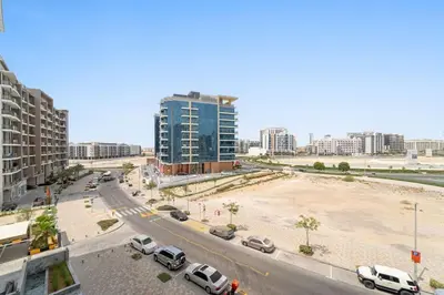 a city with cars parked on a street with buildings at Amazing 1 Bdr luxury residence Dubai Arjan in Dubai