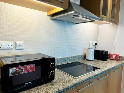 a microwave oven sitting on a counter in a kitchen at Amazing 1BR in Dubai Marina with Luxury Interiors in Dubai