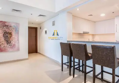 a lobby of a dental clinic with chairs in front of a counter at Luxurious 2 Bed Next to Burj Khalifa, Hosted by Desert City Stays in Dubai