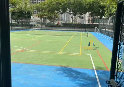 a tennis court with two tennis nets on it at Luxurious 2 Bed Next to Burj Khalifa, Hosted by Desert City Stays in Dubai