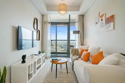 a living room with a white couch and a table at DAYF-FSL 1-Bedroom in Business Bay near Downtown Dubai in Dubai