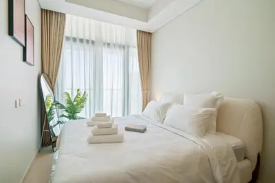 a white bed in a room with a window at DAYF-FSL 1-Bedroom in Business Bay near Downtown Dubai in Dubai