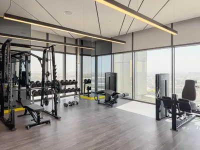 a gym with treadmills and cardio equipment in a building at DAYF-FSL 1-Bedroom in Business Bay near Downtown Dubai in Dubai