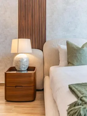 a bedroom with a bed and a lamp on a night stand at Prestigious 2BR-Noura Tower- Business Bay in Dubai
