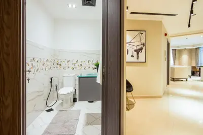 a bathroom with a sink and a toilet in a room at Marina Crown 2 BDR, Marina in Dubai