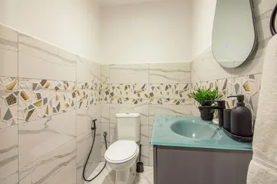 a bathroom with a toilet and a sink at Marina Crown 2 BDR, Marina in Dubai