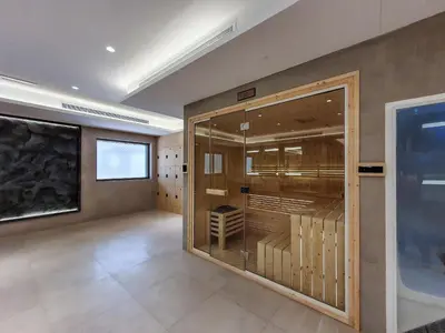a large room with a large glass display case at Elite 1 BR, Downtown in Dubai