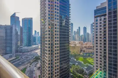 a view of a tall building in a city at Elite 1 BR, Downtown in Dubai