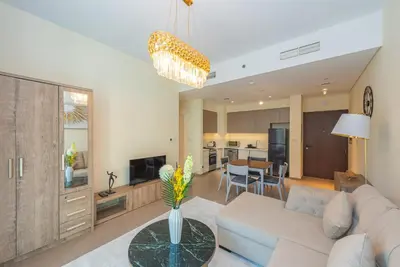 a living room with a couch and a table at Park Heights 1 BR, Dubai Hills in Dubai
