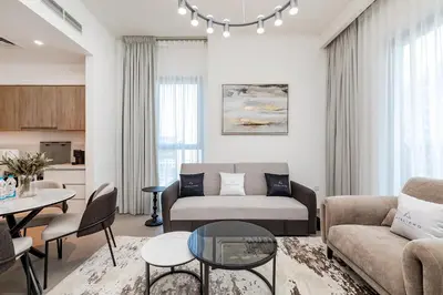 a living room with a couch and a table at Premium Apartments at Executive Residences in Dubai