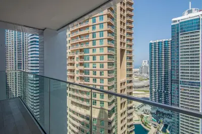 a balcony with a view of a city at Me Do Re1BR, JLT in Dubai