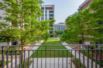 an apartment balcony with trees and a park at Park Point 1 BR, Dubai Hills in Dubai