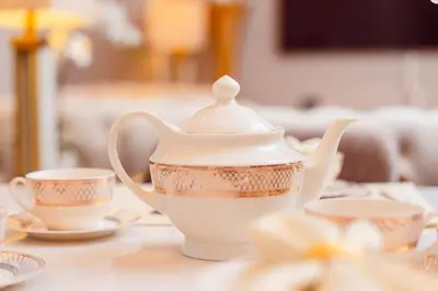 a tea pot and cups on a table at Elite Royal Apartment - Sky Series - Full Burj Khalifa & Fountain View - Chancellor in Dubai