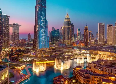 a view of a city skyline at night at Elite Royal Apartment - Sky Series - Full Burj Khalifa & Fountain View - Chancellor in Dubai
