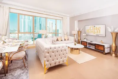 a living room with a couch and a table at Elite Royal Apartment - Sky Series - Full Burj Khalifa & Fountain View - Chancellor in Dubai