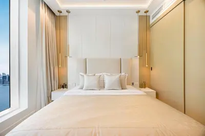 a bedroom with a large bed with a large window at Daniels Full Sea View 3BR in Oceana Atlantic in Dubai