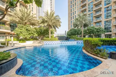 a swimming pool in the middle of a building at Exclusive Promo Luxe 1BR at a Special Price by Deluxe Holiday Homes in Dubai