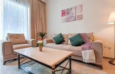a living room with a couch and a coffee table at Park Heights, Dubai Hills- Cozy 1-BR in Dubai