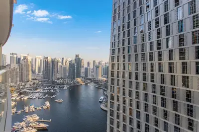 a view of a river between two tall buildings at Prival - Marina & Sea View in Dubai