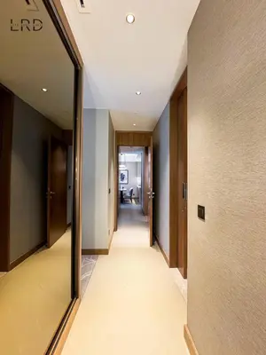a hallway with a mirror on the side of a building at Luxurious 2BR The Address Opera in Dubai