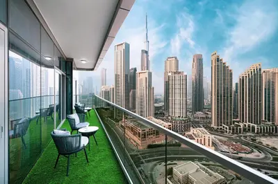 a balcony with two chairs and a view of a city at Panoramic Burj Khalifa views-64th floor infinity pool in Dubai