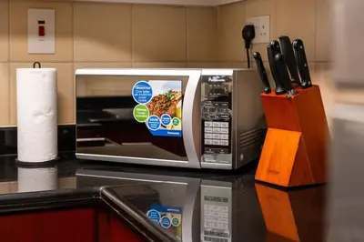 a microwave oven sitting on a counter in a kitchen at Luxury 1 bedroom apartment in JBR with Beach access in Dubai
