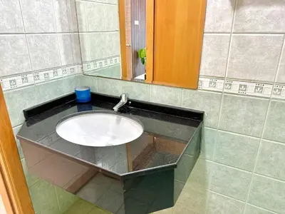 a bathroom counter with a sink and a mirror at Skyline View Premium Apartment in Dubai