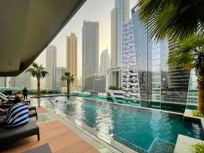 a swimming pool with a view of a city at Stylish Studio in Heart Downtown Next Dubai Mall in Dubai