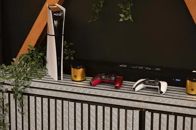two video game controllers sitting on top of a tv at Kabene Exotic, Burj Khalifa & Fountain View, 5 Starts, 4 Bedroom, Best In Dubai in Dubai