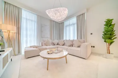 a living room with a couch and a table at Luxury 2-Bed Apartment l Emaar Beachfront in Dubai