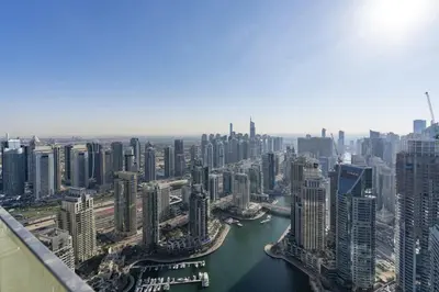 an aerial view of a city with a river and buildings at Stunning 1Bed High Floor Marina View in Dubai