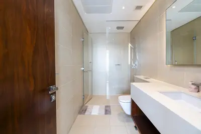 a bathroom with a toilet and a sink and a mirror at Stunning 1Bed High Floor Marina View in Dubai