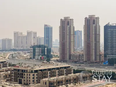 a view of a city with tall buildings at Cloud 9 - DAMAC Ghalia Tower in Dubai