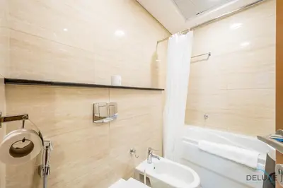 a bathroom with a toilet and a sink at Charming 1BR Apartment at Ocean Heights Dubai Marina by Deluxe Holiday Homes in Dubai