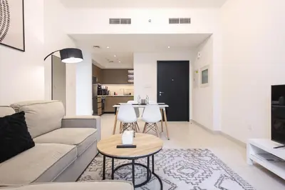 a living room with a couch and a table at Downtown Apartments - Burj Crown - 5 Min Walk to Mall in Dubai