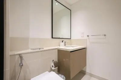 a bathroom with a sink and a mirror at Sea & City Views - Burj Crown - 5 Min Walk to Mall in Dubai