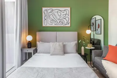 a bedroom with a bed and a couch at Silkhaus Burj Khalifa View Studio in Iconic Tower in Dubai