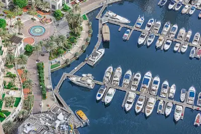 an aerial view of boats docked in a marina at Daniels 1BR Marina Horizon Retreat in Dubai