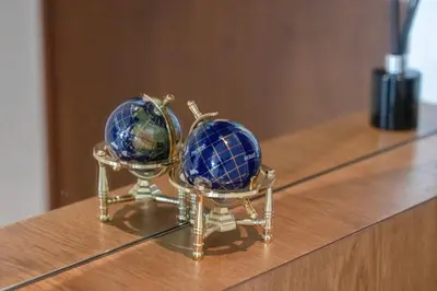 two blue spheres sitting on top of a table at Daniels 1BR Marina Horizon Retreat in Dubai