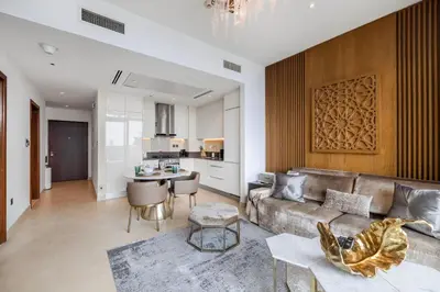 a living room with a couch and a table at Daniels 1BR Marina Horizon Retreat in Dubai