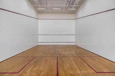 an empty room with white walls and a wooden floor at Silkhaus Spacious Studio in Heart of DIFC in Dubai