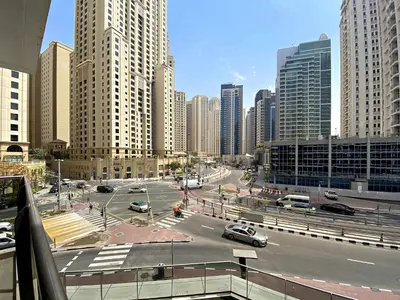 a view of a city with cars on a street at Silkhaus Stylish 1 BDR with Luxurious vibes in Dubai