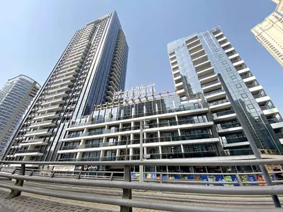 two tall buildings in a city with a freeway at Silkhaus Stylish 1 BDR with Luxurious vibes in Dubai