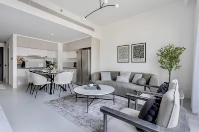 a living room with a couch and a table at Frank Porter - Marina Vista Podium 3 in Dubai