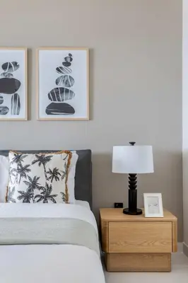 a bedroom with a bed and a table with a lamp at Frank Porter - Marina Vista Podium 3 in Dubai