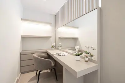 a room with a desk with a chair and a mirror at JuliusHomes - 5BR Villa with Pool in Palm Jumeirah in Dubai