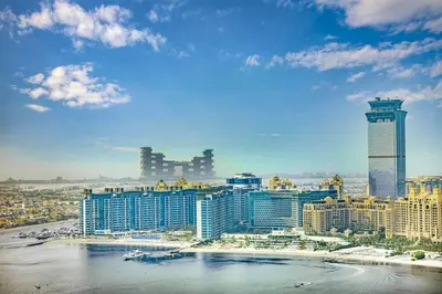 a view of a city with a beach and buildings at Fully Equipped 1BR with Private Beach Access in Dubai