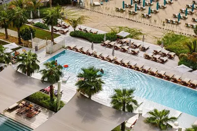 an overhead view of a swimming pool at a resort at Panoramic Sea View 2BR in JBR in Dubai