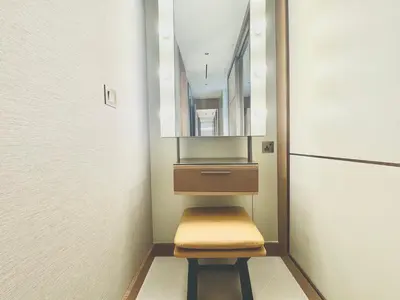 a stool in a room with a mirror and a drawer at Vista Luxe 3 Bedroom at Address Opera I Burj Khalifa & Fountain Views in Dubai