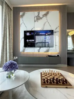 a living room with a chess board and a television at Incredible View - Fountain show - 4BR - PS5 and Games in Dubai